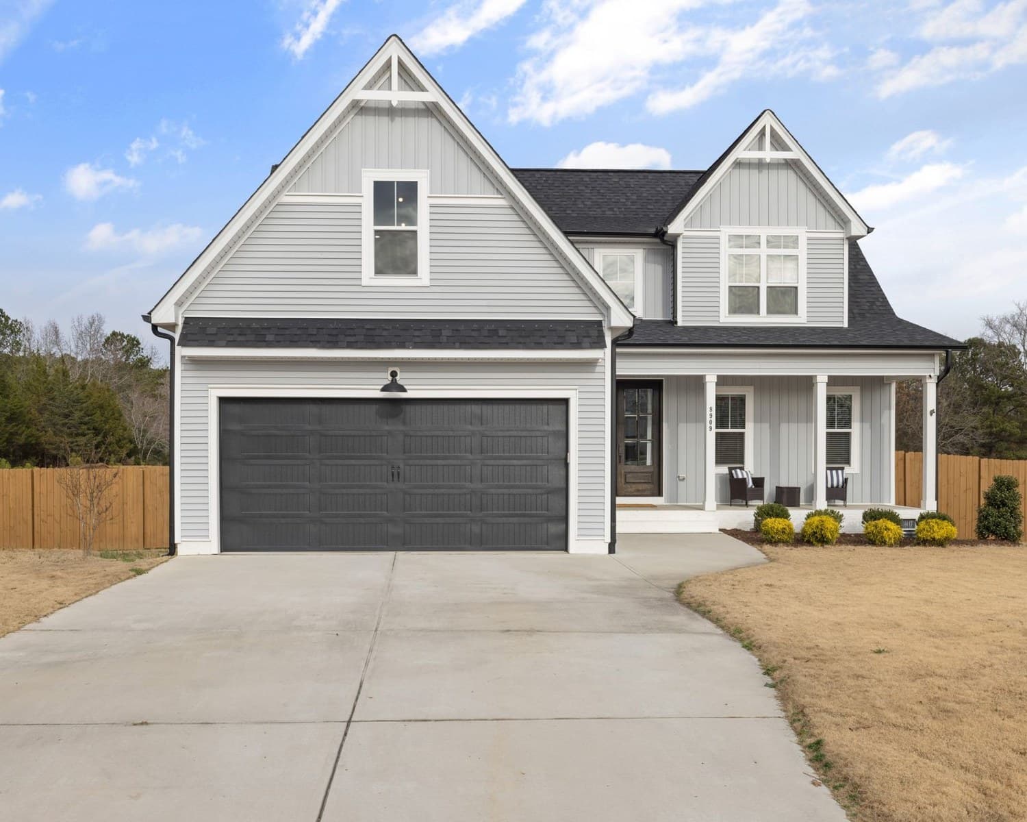 Representative residential facade showing siding, trim, window openings, and exterior transitions