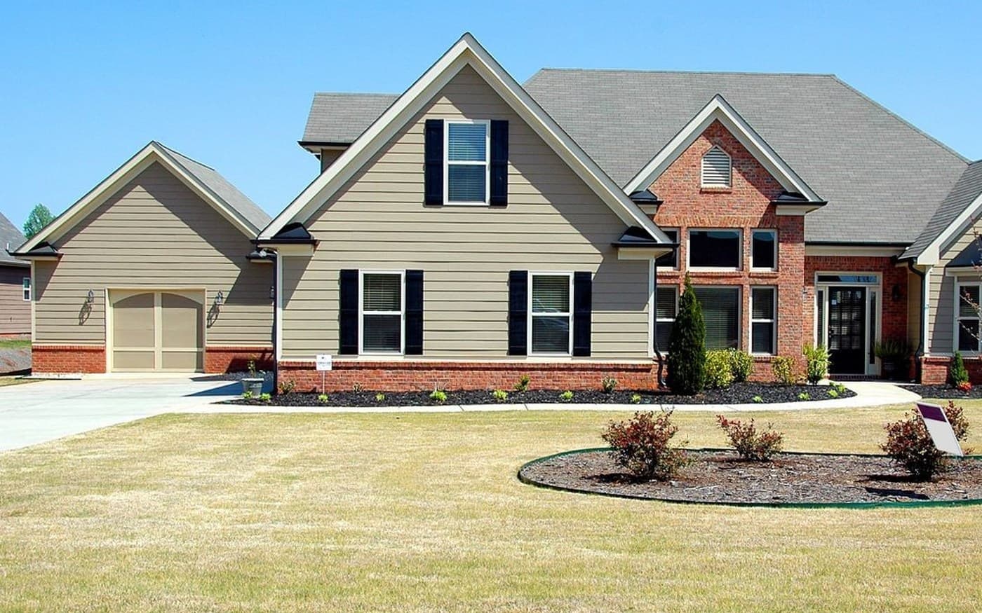 Representative suburban home with visible siding, trim, windows, and roof transitions